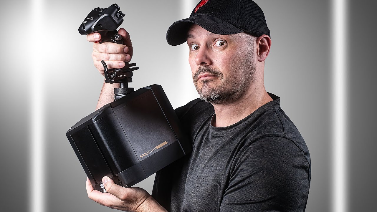 Man holding the Moza AB9 Force Feedback Joystick
