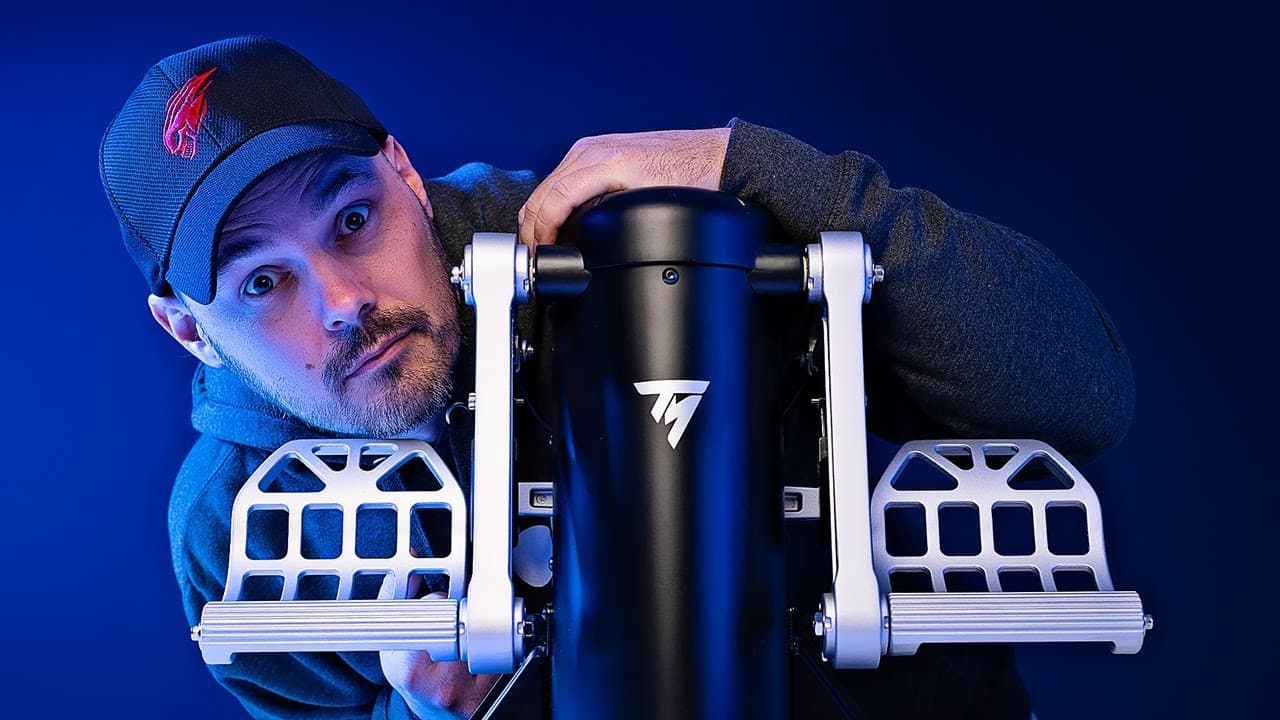 Man holding on to a set of Thrustmaster TPR Rudders pedals