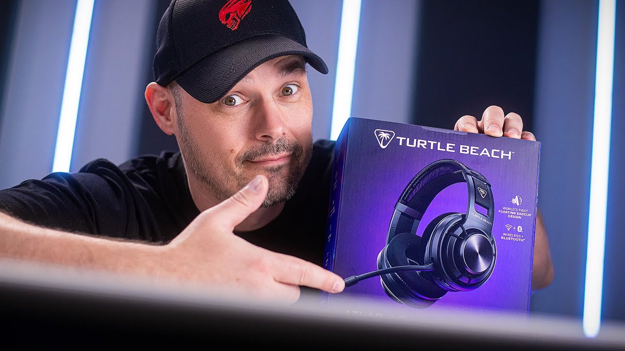 man holding a pair of Turtle Beach Atlas Air Headphones