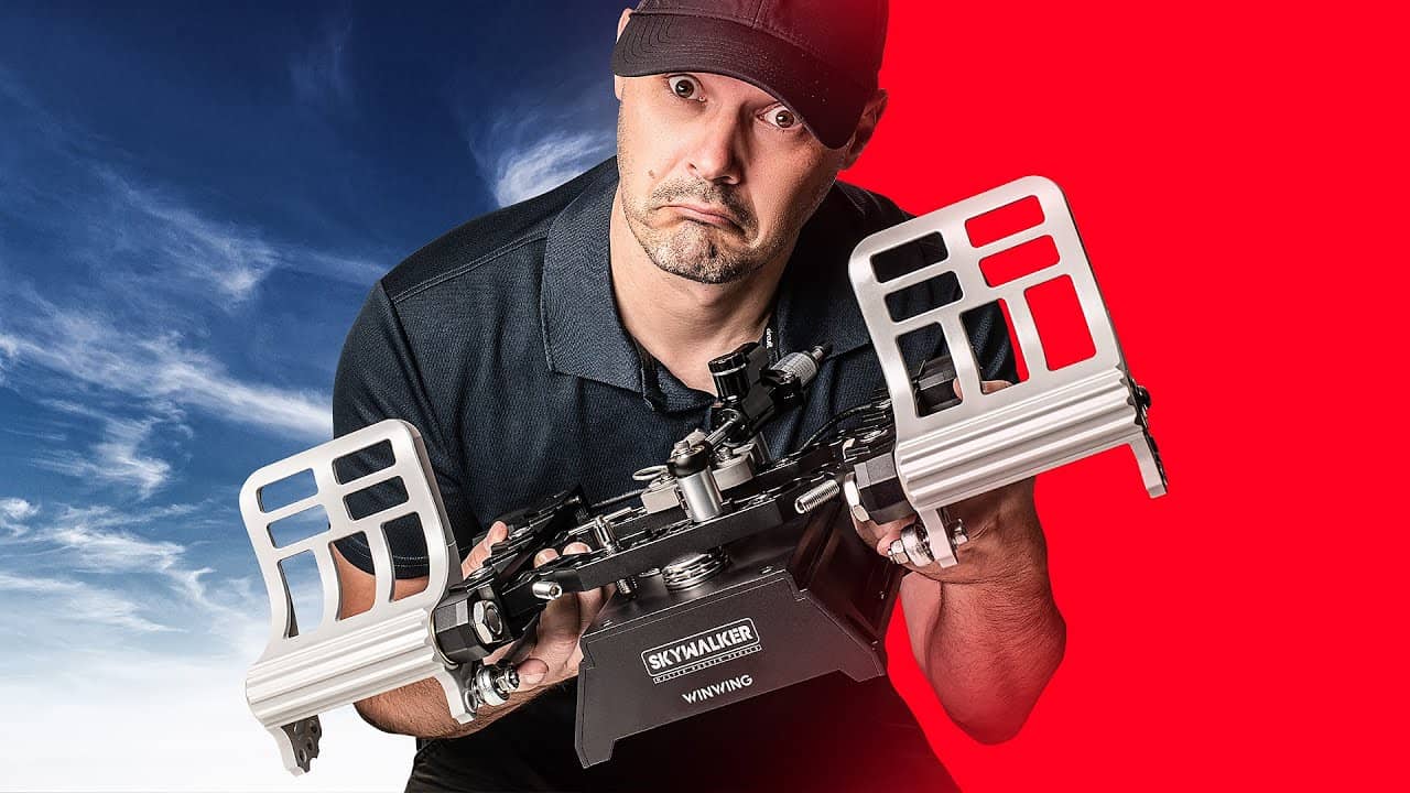 Man holding the WINWING or WINCTRL rudder pedals with a confused face